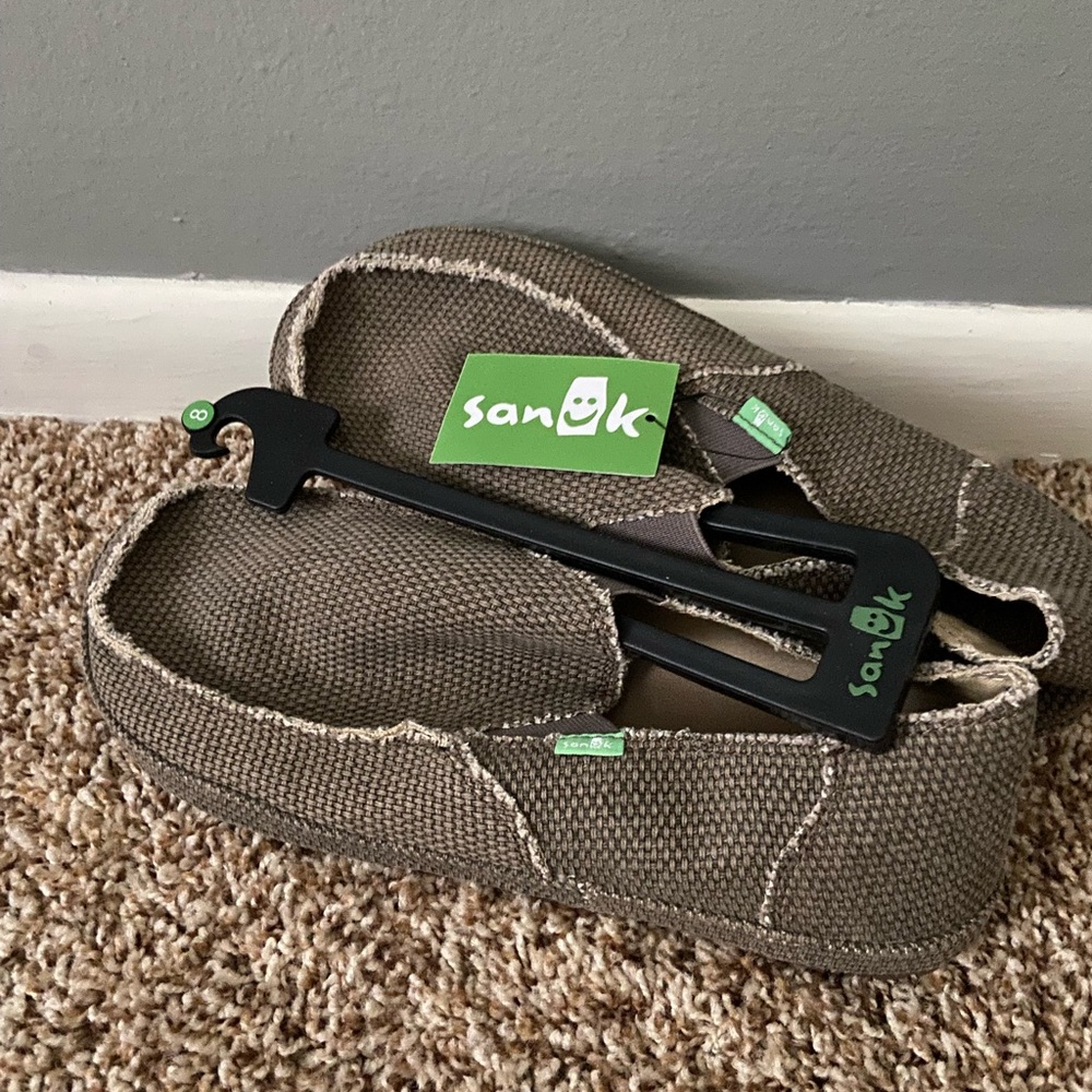 Men’s Sanuk slip on shoes.  Size 8